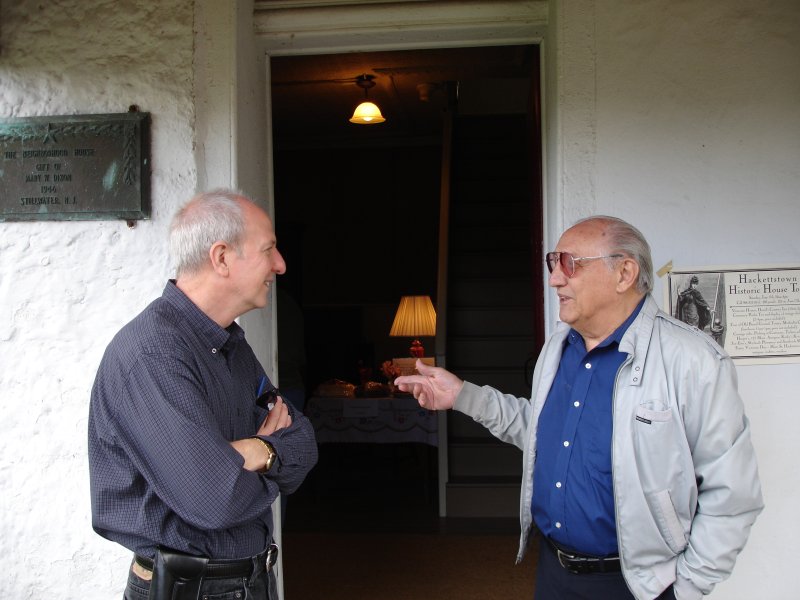 Historical Society Officers, Mike Wiley and Rudy Spatarella talk serious business before the festival begins